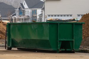 construction waste in a large green container metal iron